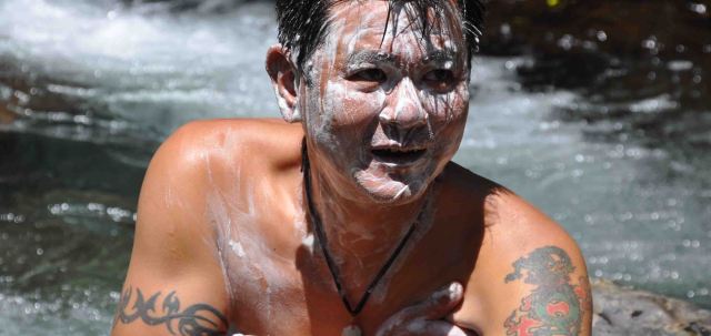 One of our guides, Momo washes in the river.