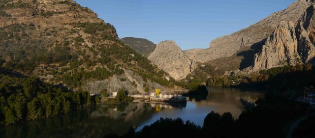 The Hydro electric system reflects in the still waters under the cliffs of El Chorro